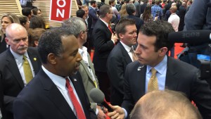 Ben Carson speaks quietly with the media following his performance on the debate stage.