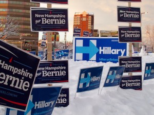 Campaign signs outside the Verizon Center before at the McIntyre-Shaheen 100 Club Celebration in downtown Manchester. Photo by Mary-Margaret Koch