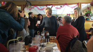 Clinton speaks with a father and daughter who say they won't vote for her Tuesday. 