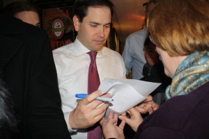 Senator Marco Rubio signs his autograph for supporters at a rally at the Barley House Restaurant and Tavern in Concord, NH on Monday. 