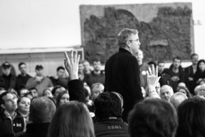 Audience members raise their hands for the chance to ask former governor Jeb Bush a question. Photo by Anna Sortino. 