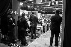 Guards watch the debate from the back of the spin room. Photo by Anna Sortino. 