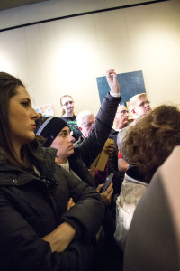 Brenna Crombie raises her hand to ask Chris Christie a question. Photo by Anna Sortino. 