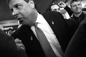 Governor Christie squeezes through the crowd to exit the coffee shop. Photo by Anna Sortino. 