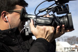 Jose De Bastos films with a Panasonic camera. Photo by Anna Sortino. 