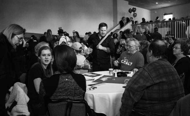 Guests wait for Carly Fiorina to speak at her pre-Super Bowl party. Photo by Anna Sortino
