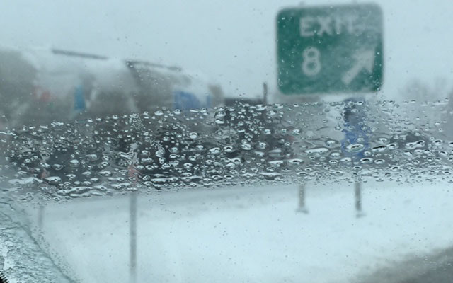 More than 4 inches of snow falls during the morning and afternoon in Manchester, N.H., where candidates are campaigning before the Tuesday primary. Photo by Bill Gentile