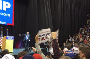 Donald Trump thanks a crowd of nearly 5,000 at the Verizon Wireless Arena in Manchester the night before the primary. Photo by Kyle VonEnde