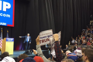 Donald Trump thanks a crowd of nearly 5,000 at the Verizon Wireless Arena in Manchester the night before the primary. Photo by Kyle VonEnde